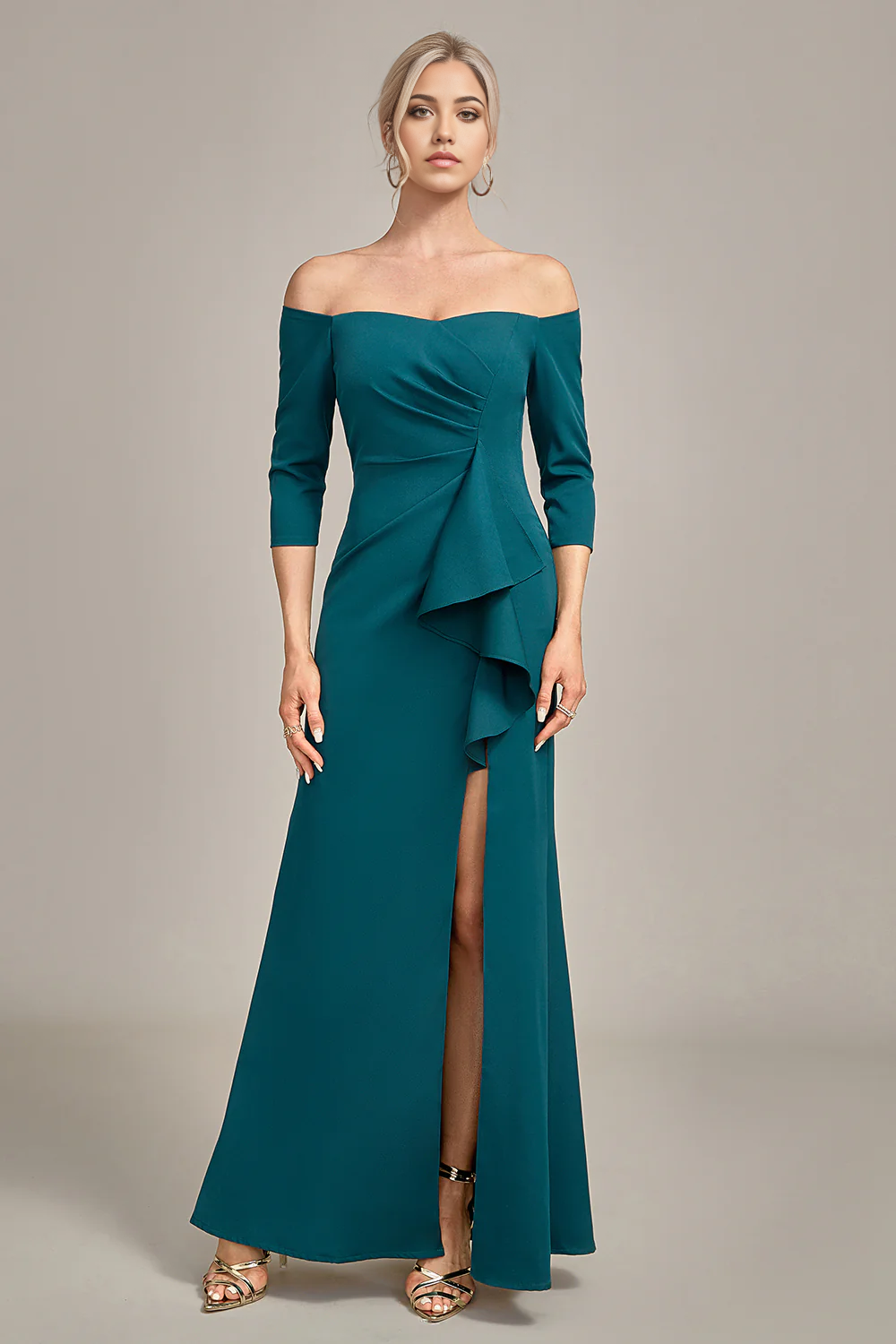 Woman in an elegant mermaid off-shoulder mother of the bride dress with cascading ruffles.