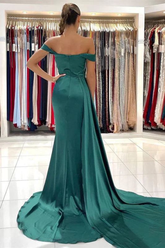Back view of the dark green off-shoulder ruffled mermaid gown.