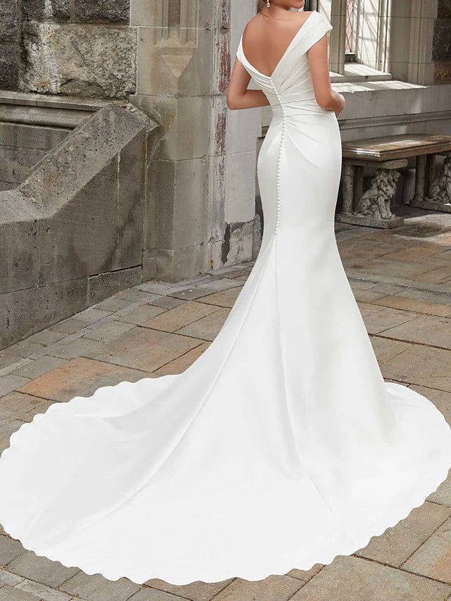 Back view of a mermaid off-shoulder satin long wedding dress.