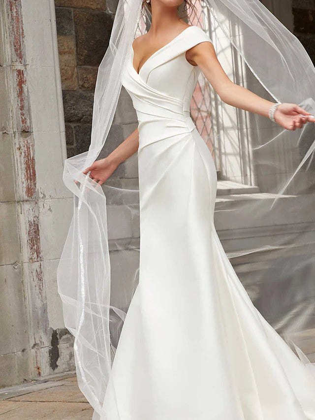 Side view of a mermaid off-shoulder satin long wedding dress.