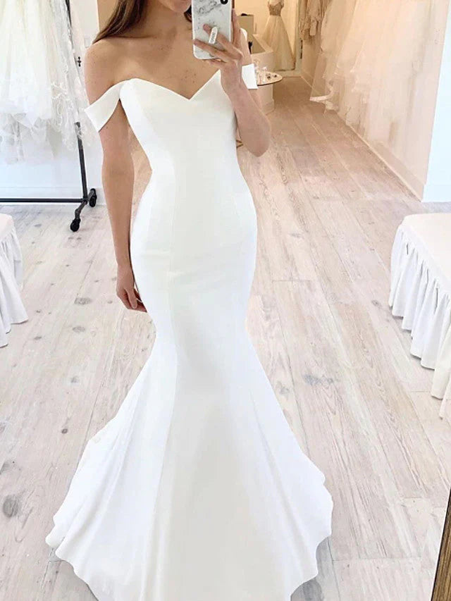 Elegant mermaid off-shoulder satin wedding dress.