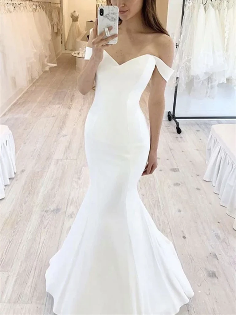 Elegant white mermaid off-shoulder wedding dress.