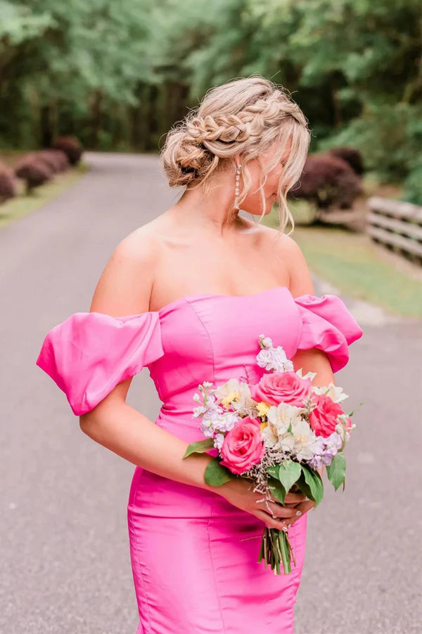 Back view of a long hot pink mermaid gown.