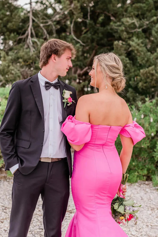 Side profile of an elegant hot pink strapless mermaid dress.