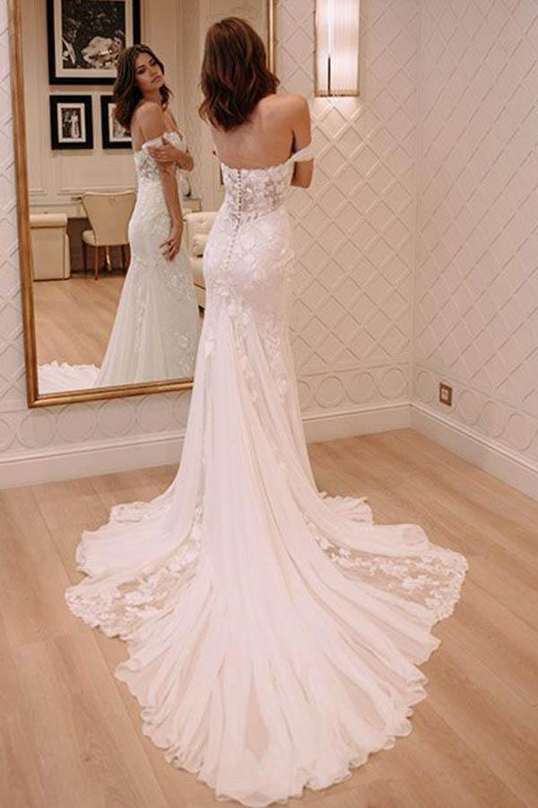 Back view of mermaid wedding dress showing court train and lace details.