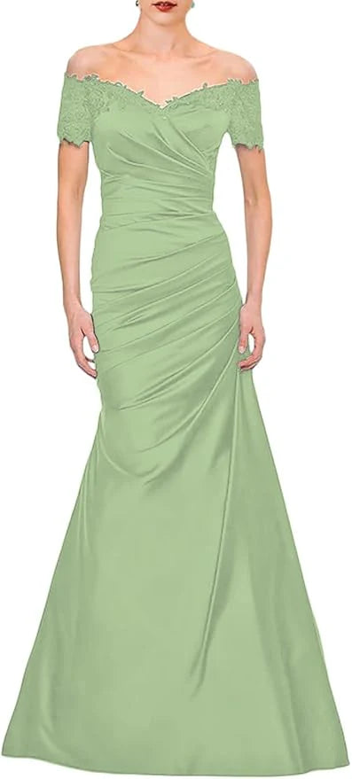 Close-up of the off-shoulder V-neckline and lace details on the dress.