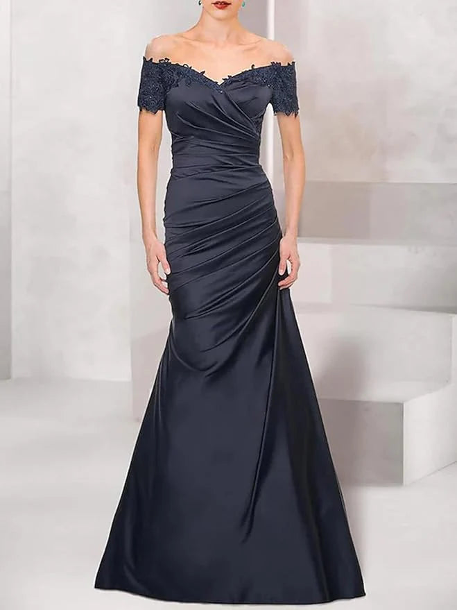 Mermaid gown with intricate lace and ruffle details.