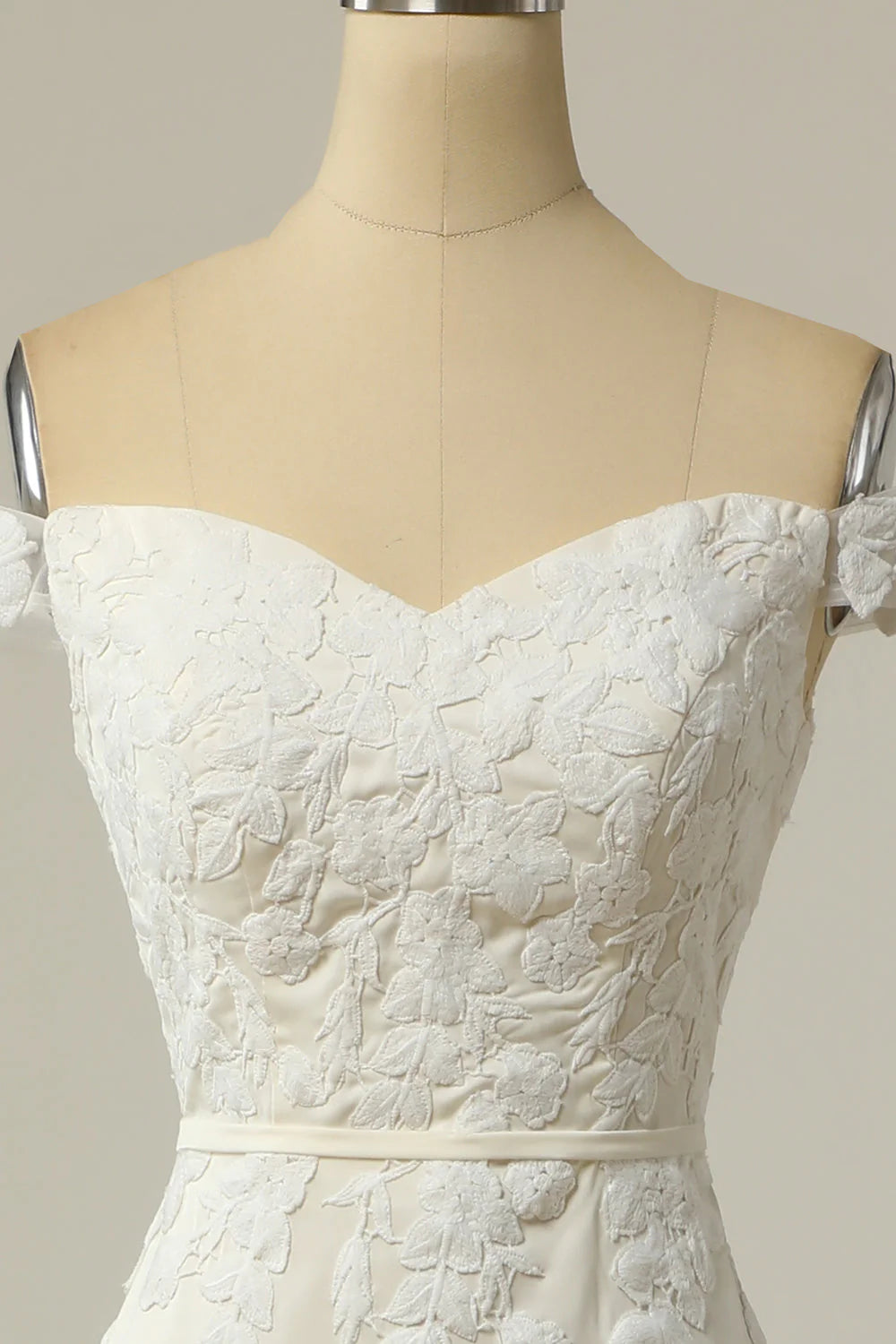 Back view of the mermaid wedding dress, showcasing the train and appliques.