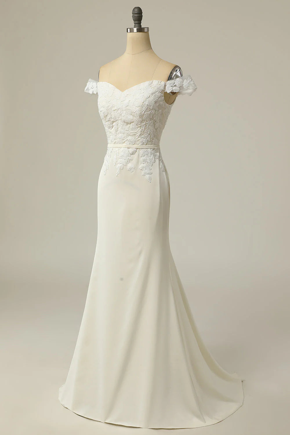 Side view of a bride wearing the mermaid off-shoulder wedding dress.
