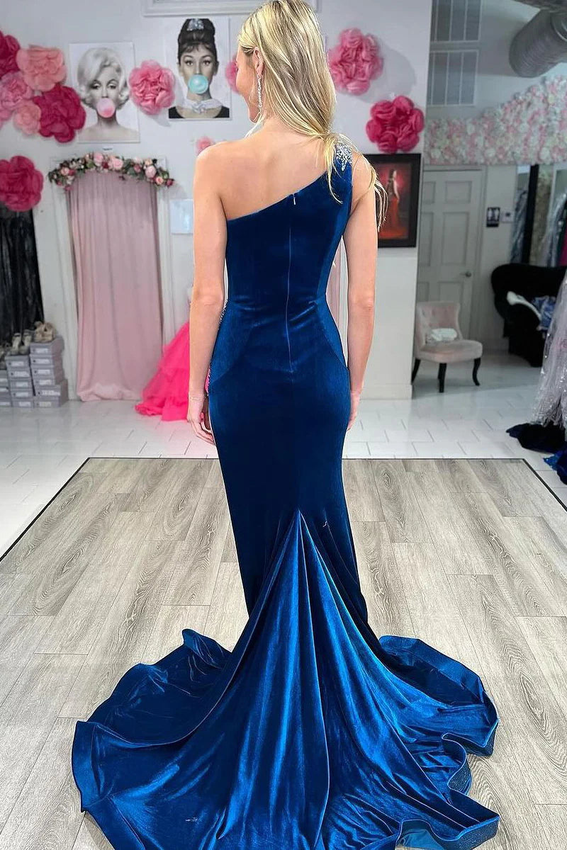 Close-up of the delicate beading on the navy velvet one-shoulder prom dress.