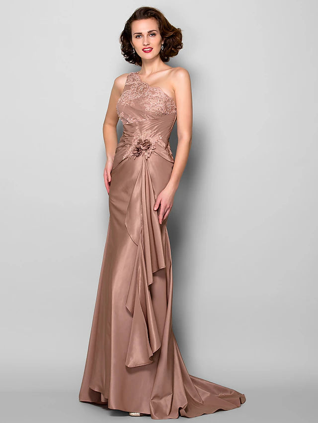 Side profile of the one-shoulder floral lace gown.