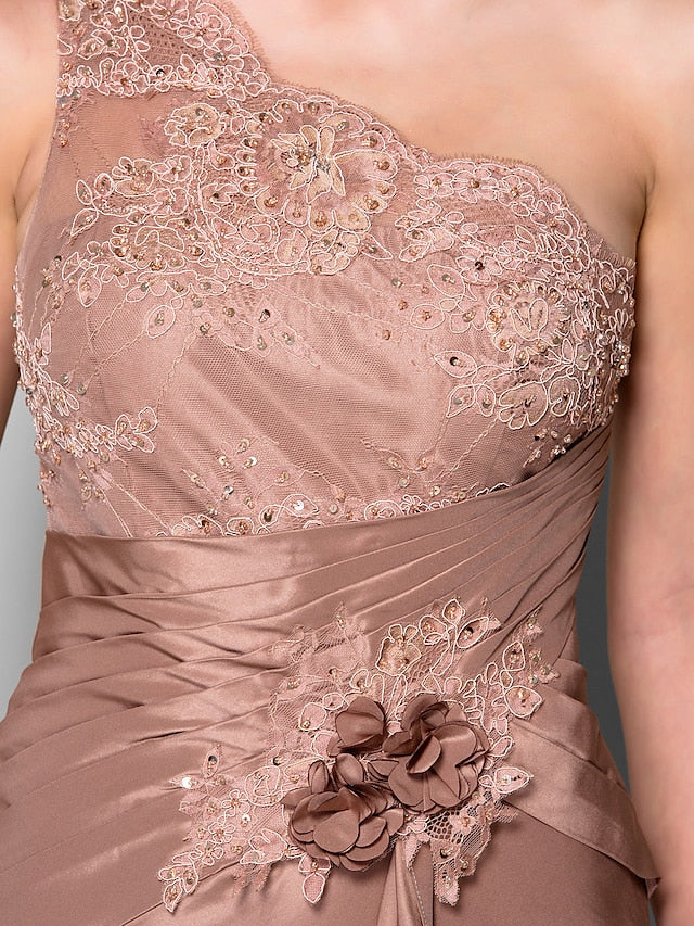 Model wearing the one-shoulder formal gown, showcasing its elegant drape.