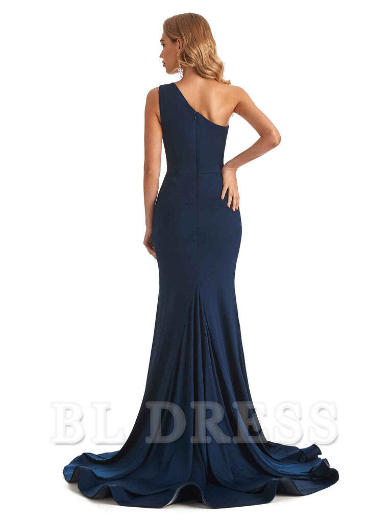 Close-up of the mermaid one-shoulder dress, highlighting the fabric and silhouette.