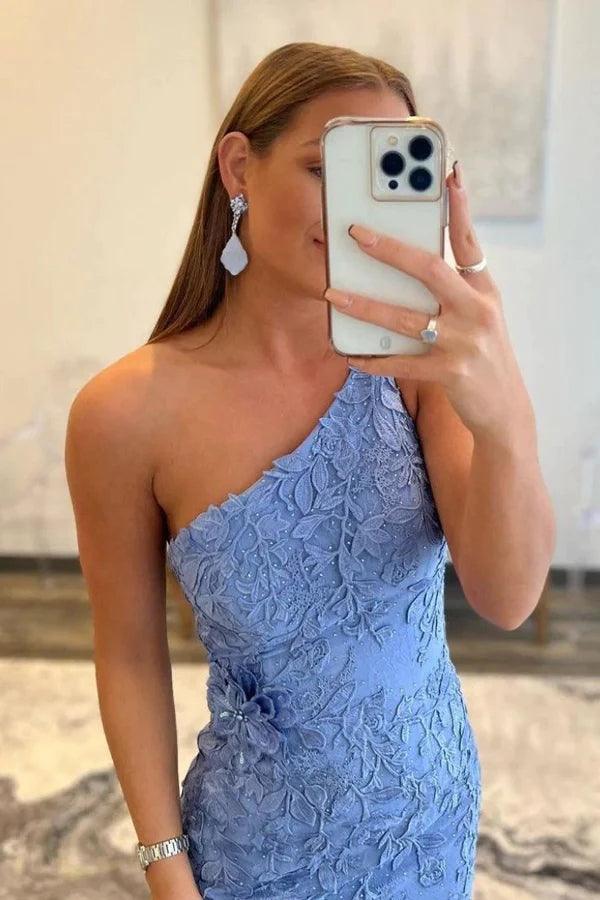 Side view of a woman wearing a long lace evening gown.