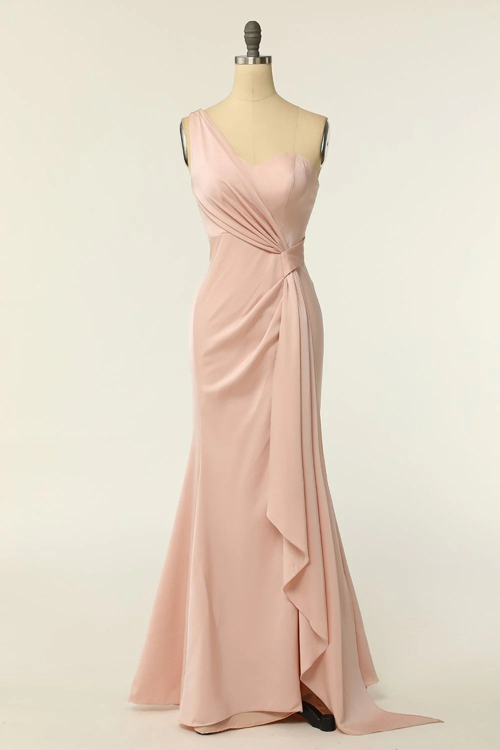 Full length view of a woman posing in a blush mermaid one-shoulder bridesmaid gown.