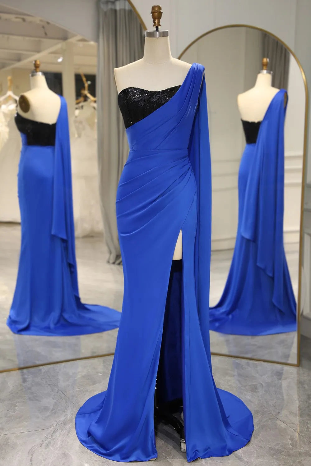 Royal blue mermaid one-shoulder prom dress with slit and matching shawl.