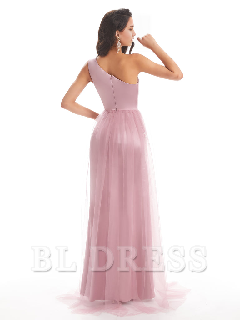 Side view of woman in one-shoulder formal satin dress.