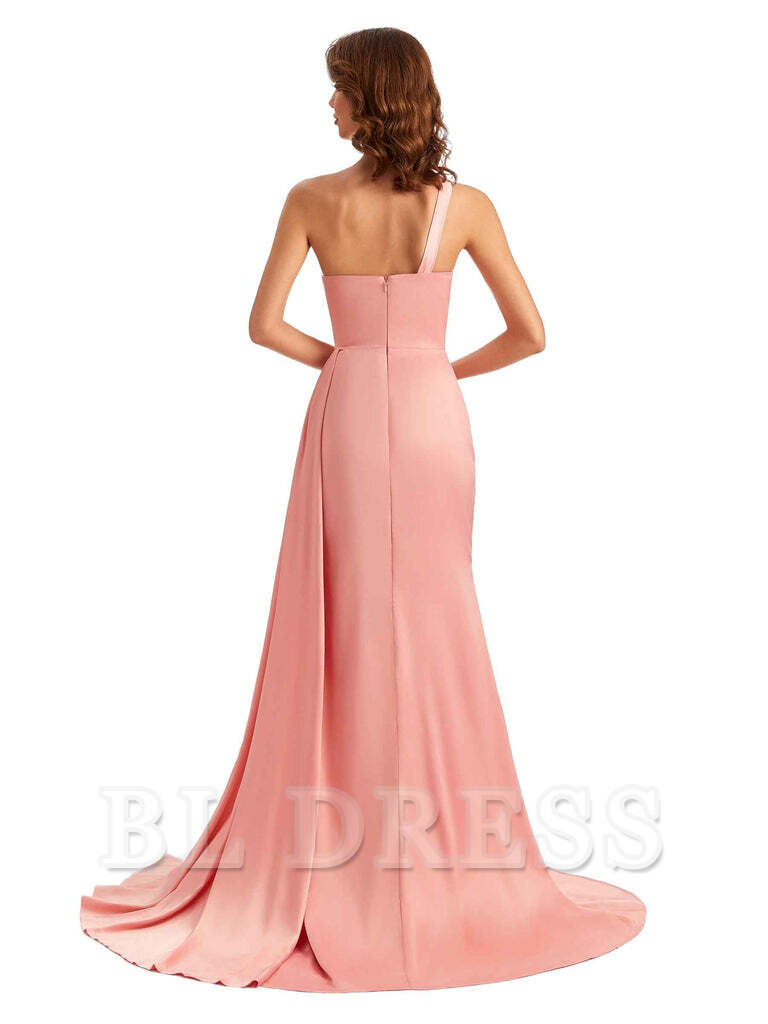 Back view of a woman in a one-shoulder satin mermaid dress.