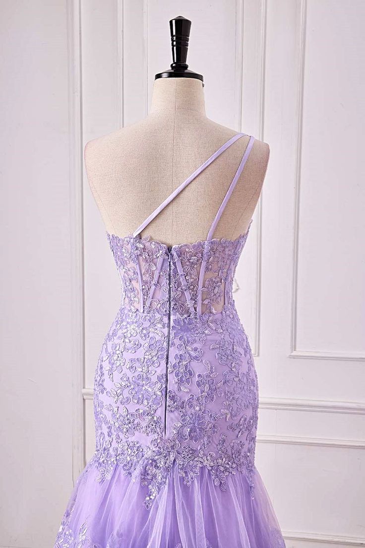 Back view of a violet purple one-shoulder mermaid prom dress with tiered ruffles.