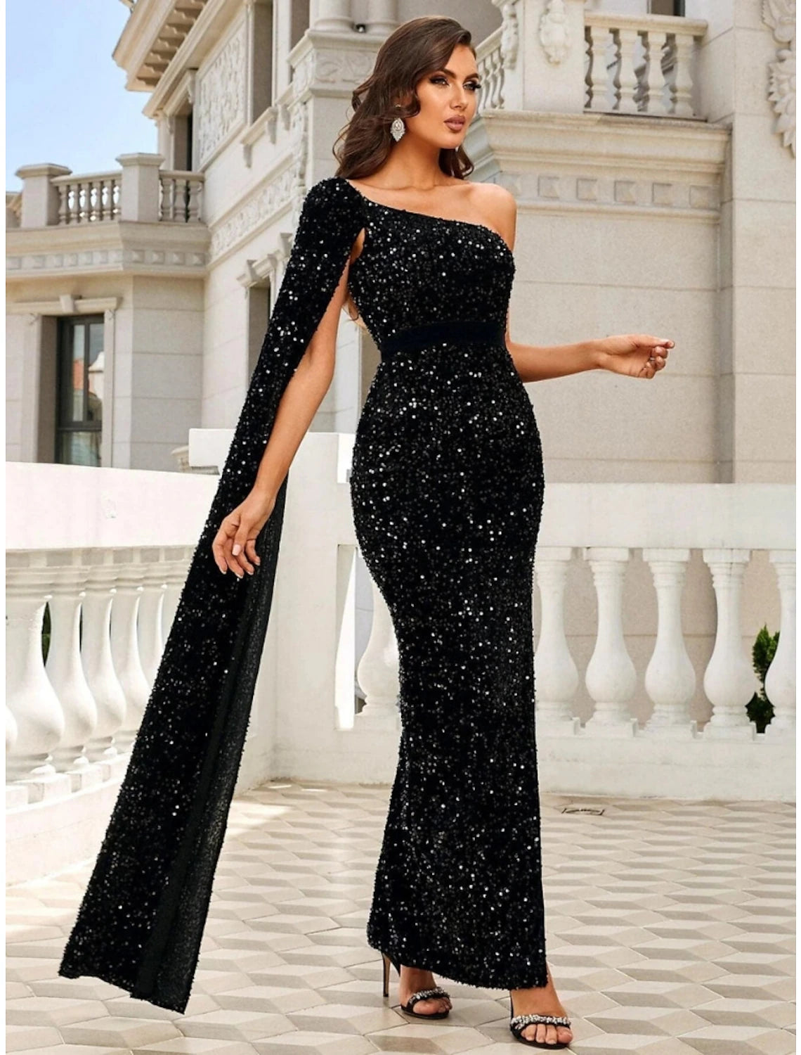 Black sequined mermaid evening gown with one-shoulder design and glitter slit.