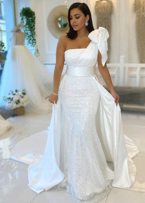 Elegant mermaid one-shoulder wedding dress in white.