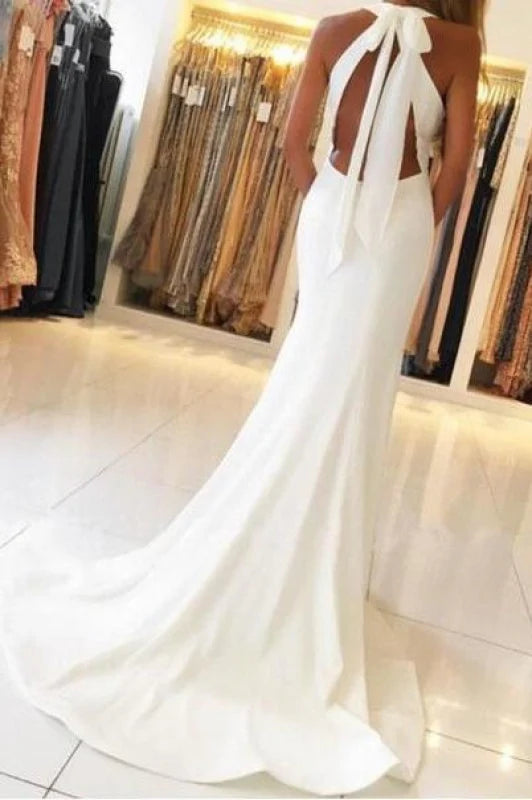 Mermaid formal prom dress featuring an open back and long train.
