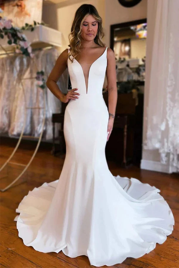 Mermaid wedding dress with plunge V-neck and court train.