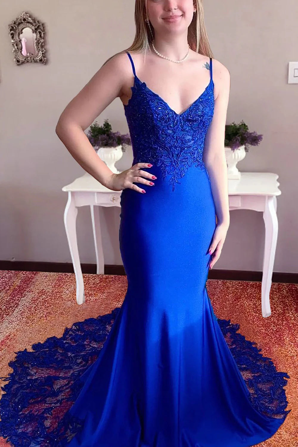 Elegant mermaid prom dress with appliques and spaghetti straps, front view.