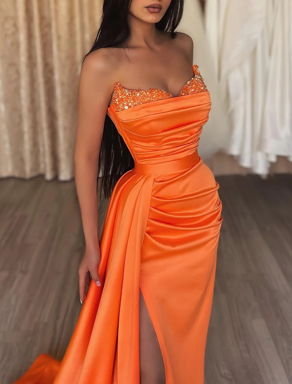 Front view of the mermaid dress, emphasizing the shimmering sequins and elegant drape.