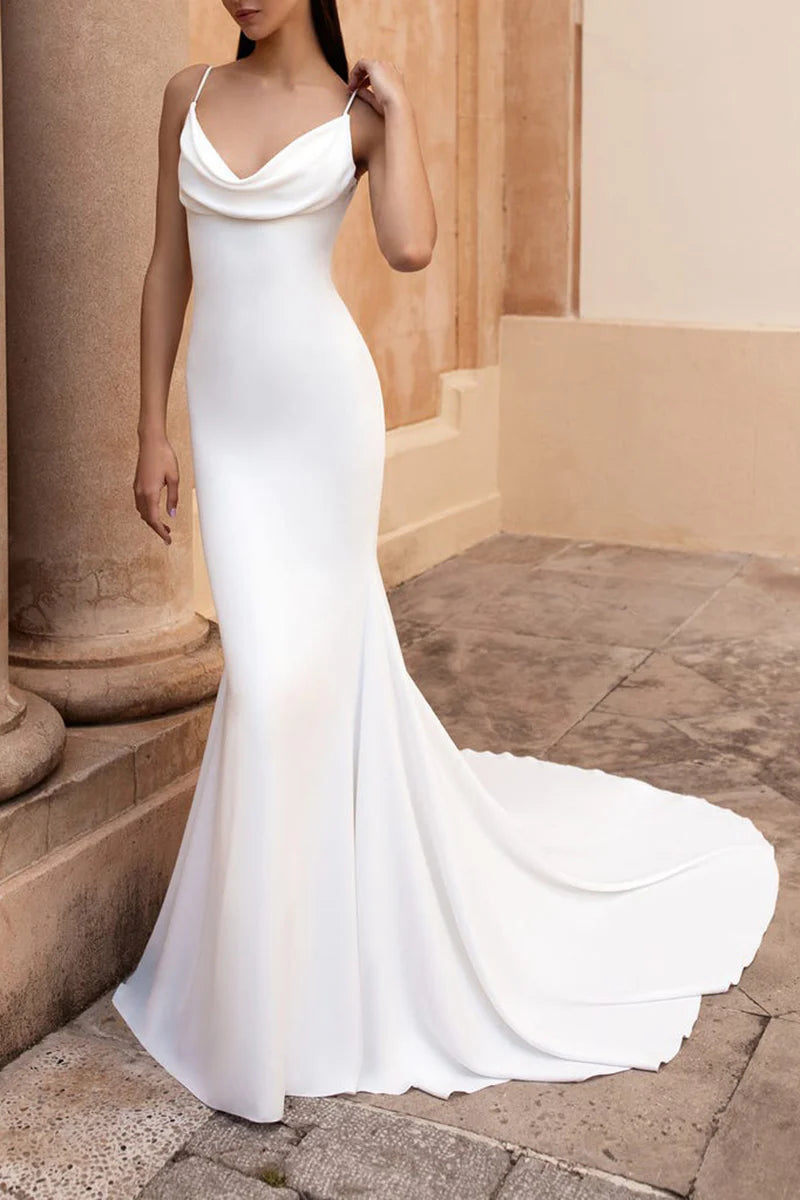 Front view of an elegant mermaid satin wedding dress with spaghetti straps.