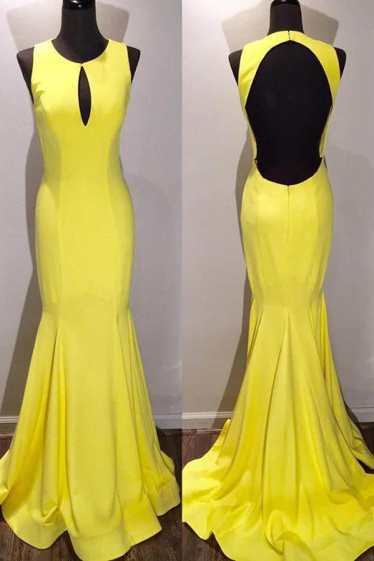 Elegant mermaid gown with a scoop neckline, open back, and sweep train.