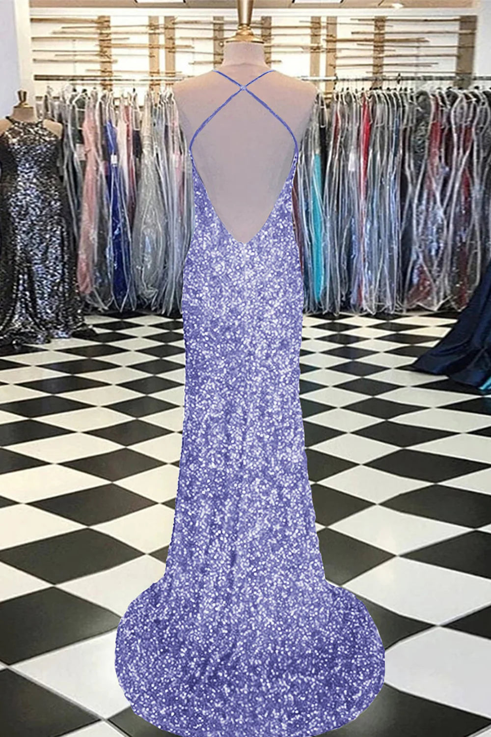 Woman in a purple mermaid sequin prom dress, with a close-up on the sequin detail.