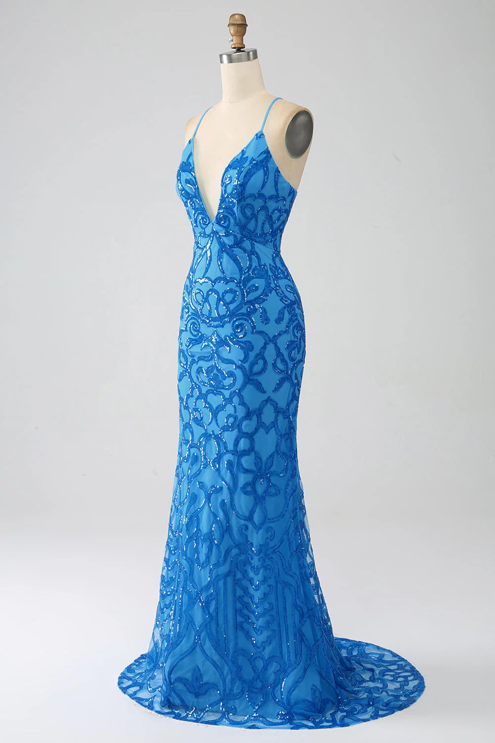 Close-up of sequin detail on a mermaid formal dress.