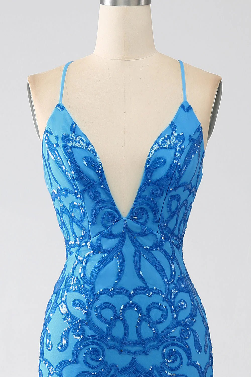 Back view of a mermaid sequin spaghetti strap long dress.