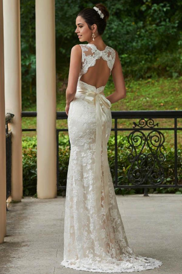 Front view of a V-neck mermaid wedding dress with intricate lace details.