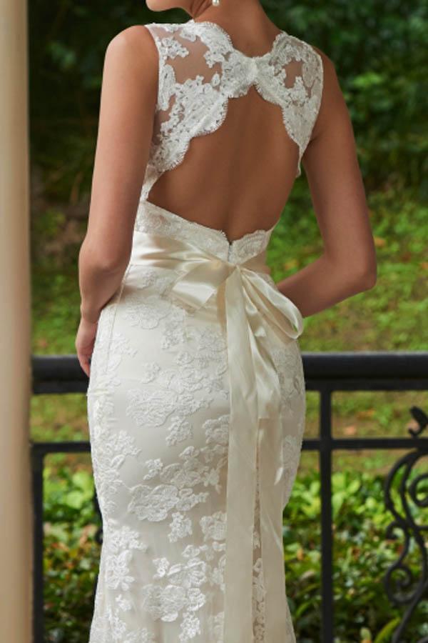 Back view of a mermaid wedding dress showcasing the sweep train and lace.