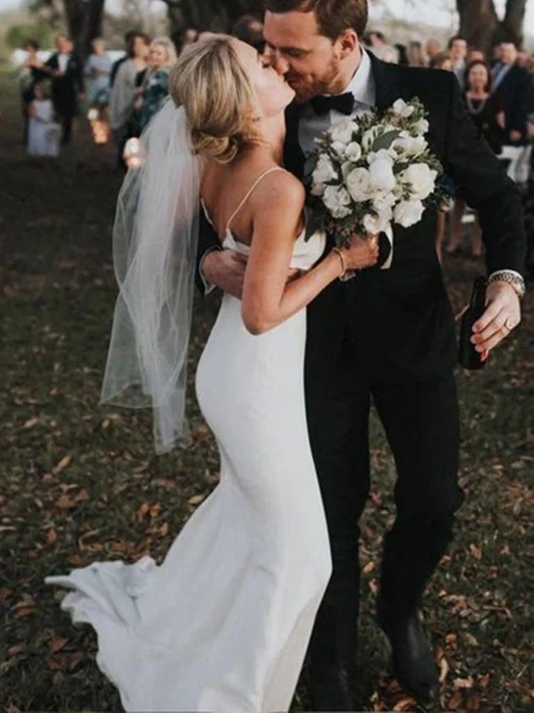 Back view of white mermaid wedding dress showing backless design.