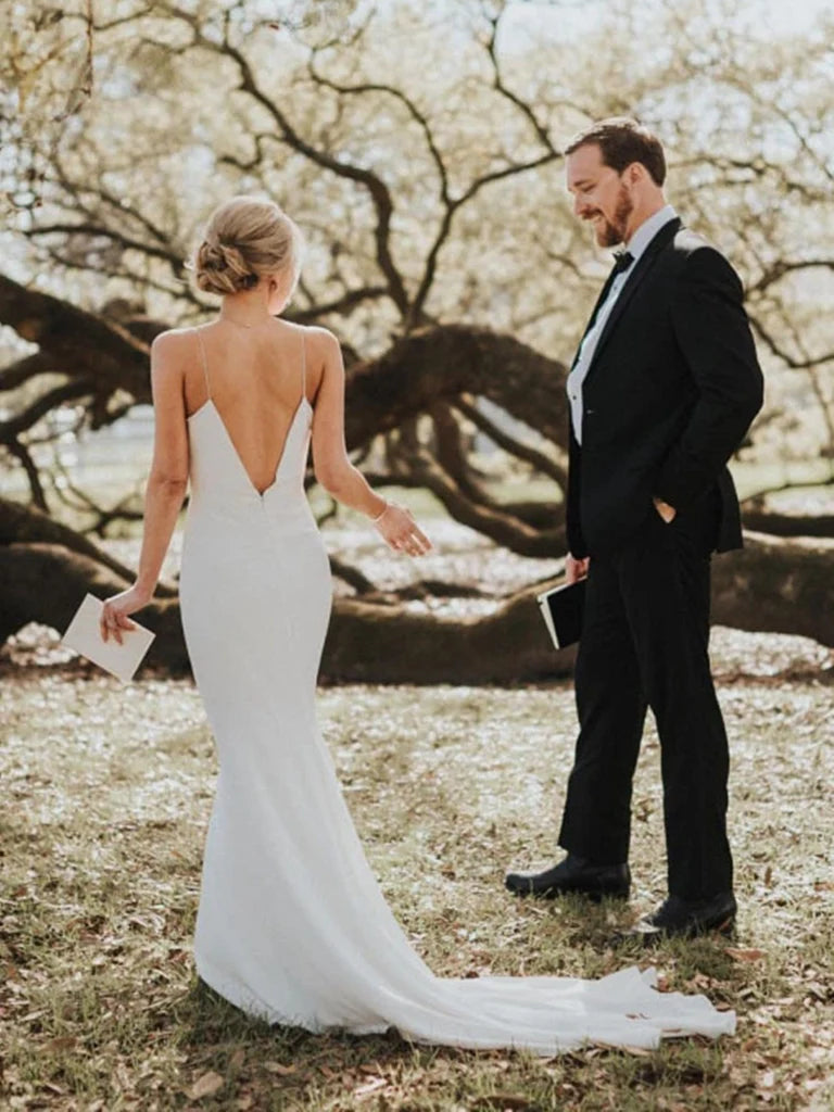 Side view of elegant white mermaid wedding dress.