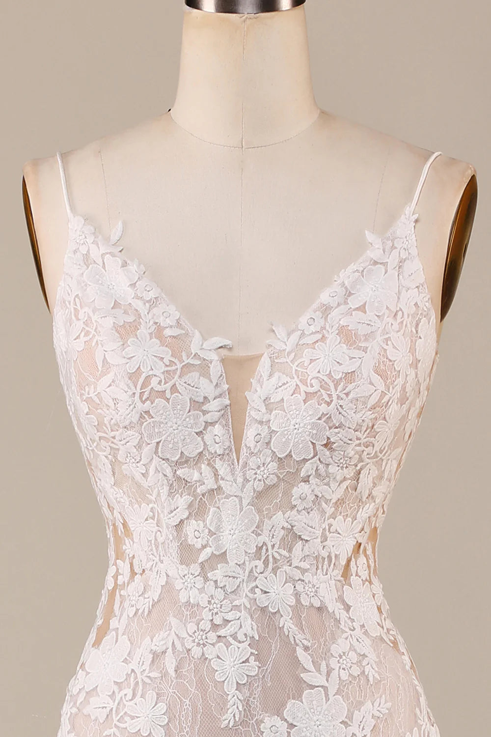Close-up of the bodice and appliques on the spaghetti strap mermaid wedding gown.