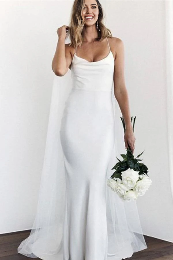 Elegant white mermaid wedding dress with spaghetti straps and a flowing court train.
