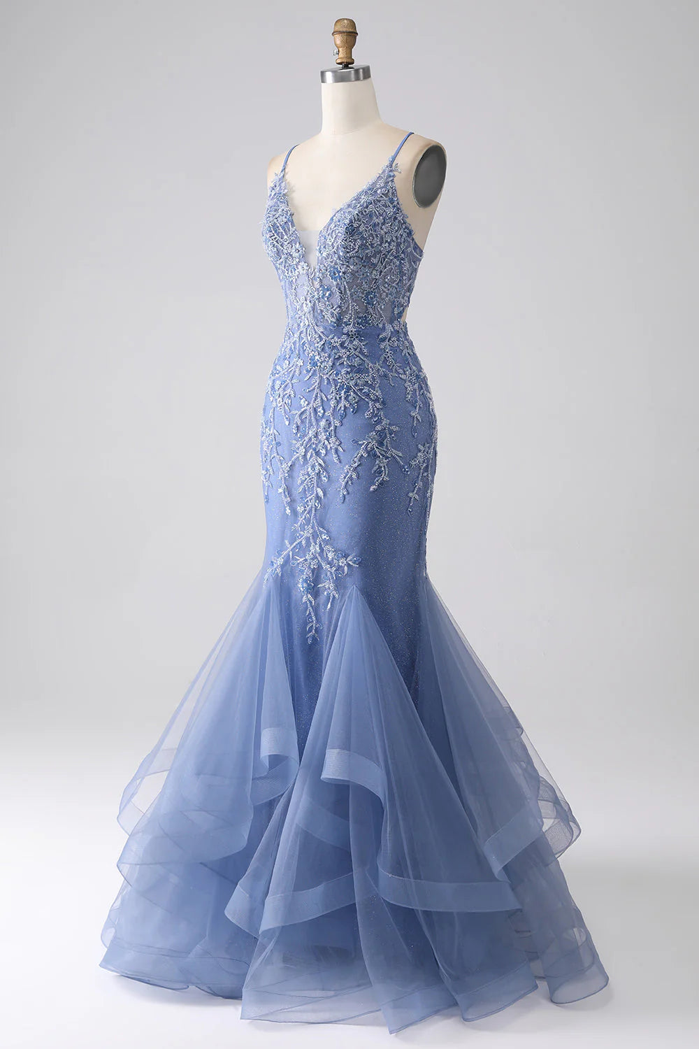 Back view of the grey-blue prom dress, showcasing the stylish backless design and delicate beading.