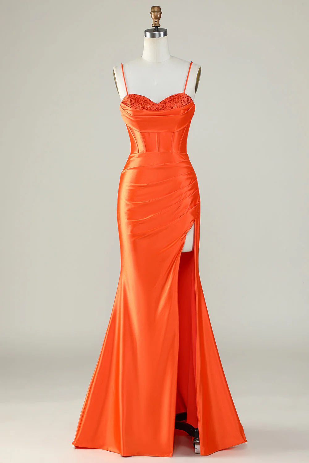 Elegant orange mermaid prom dress with spaghetti straps and corset bodice.
