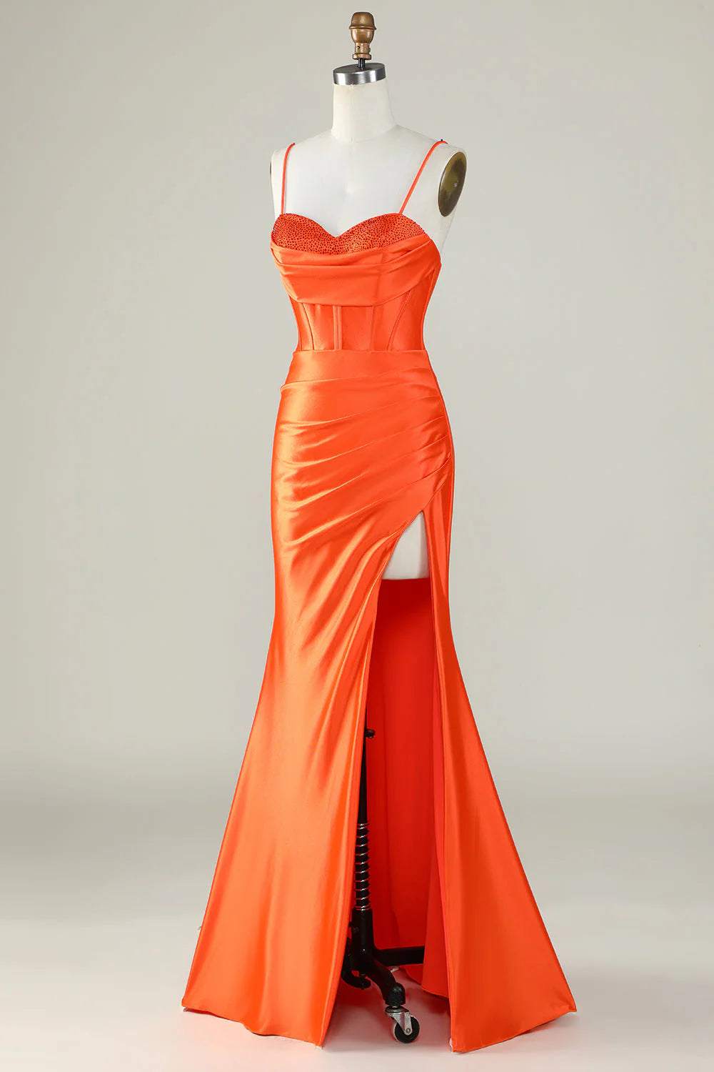 Close-up of the corset detail on an orange mermaid dress.