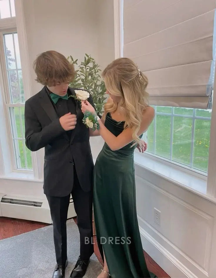 Green mermaid evening gown with delicate spaghetti straps.