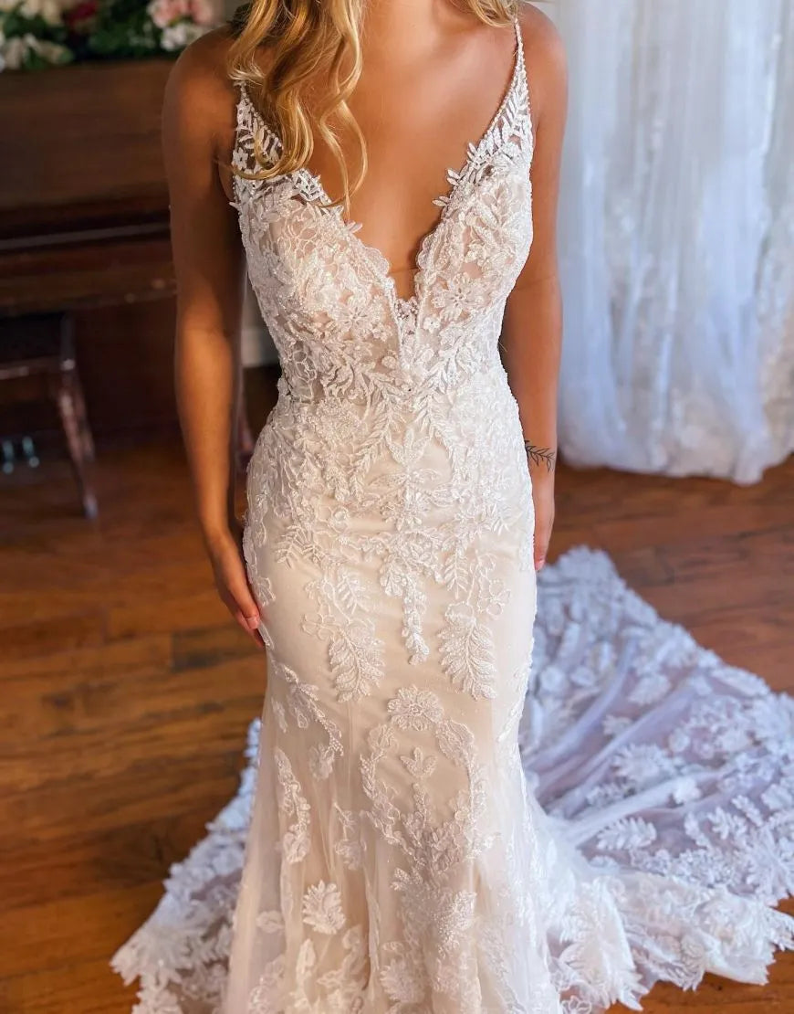 Side view of elegant mermaid bridal gown.