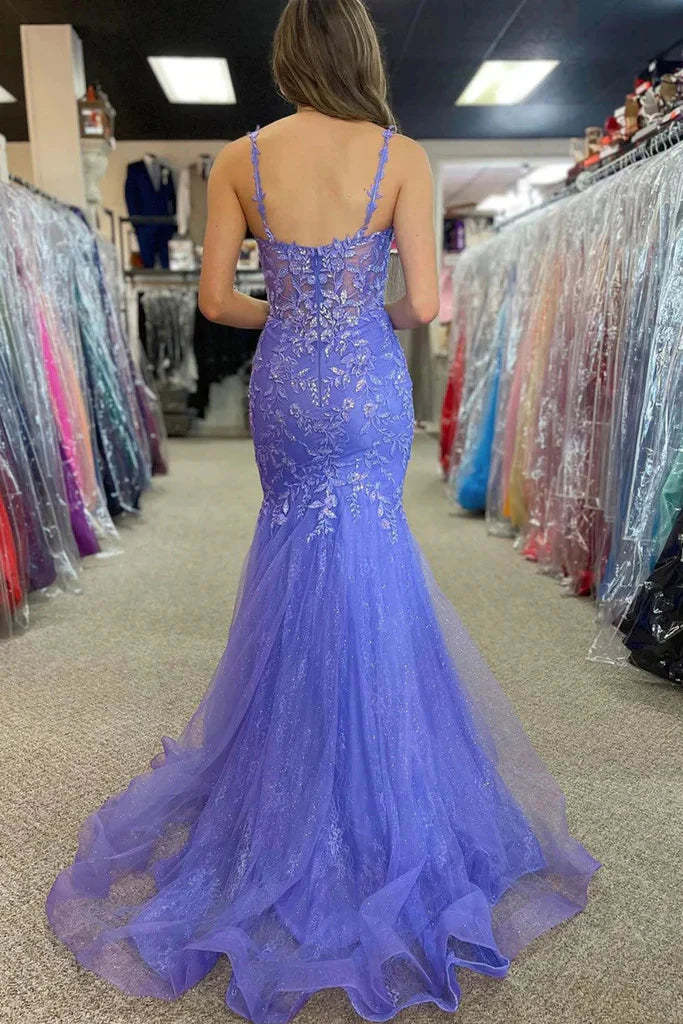Side view of an elegant mermaid prom dress with lace and spaghetti straps.