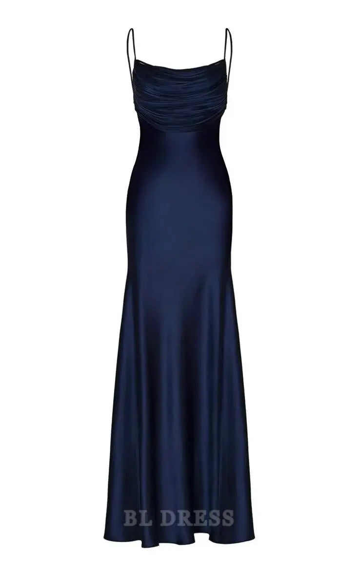 Woman wearing an elegant navy blue satin mermaid gown with spaghetti straps.
