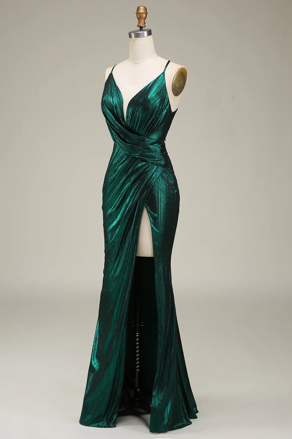Side view of a dark green mermaid prom dress, highlighting the silhouette.