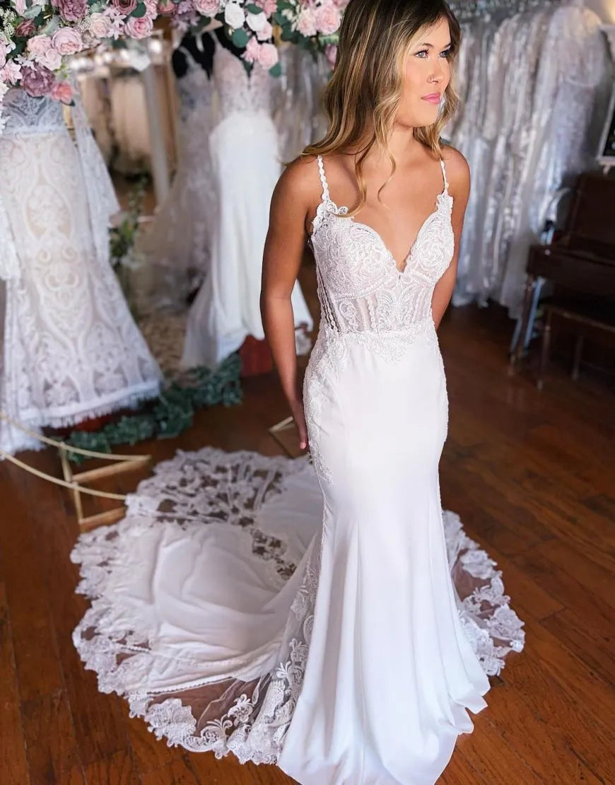 Mermaid spaghetti strap satin wedding dress with appliques, front view.