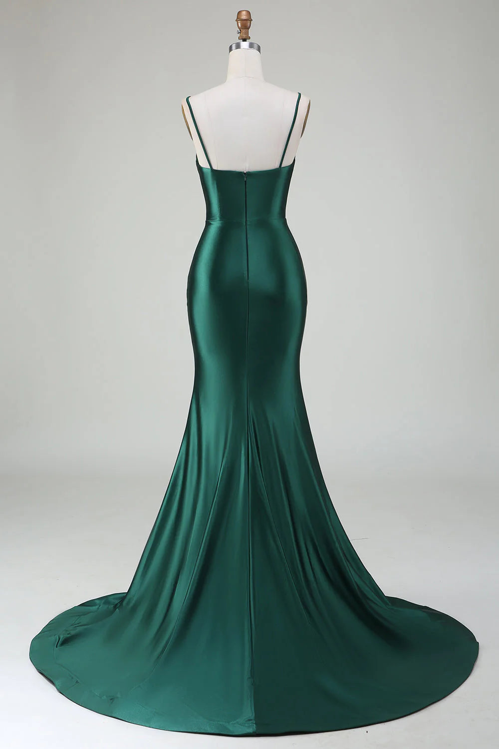 Side view of dark green mermaid gown, highlighting the sweep train.